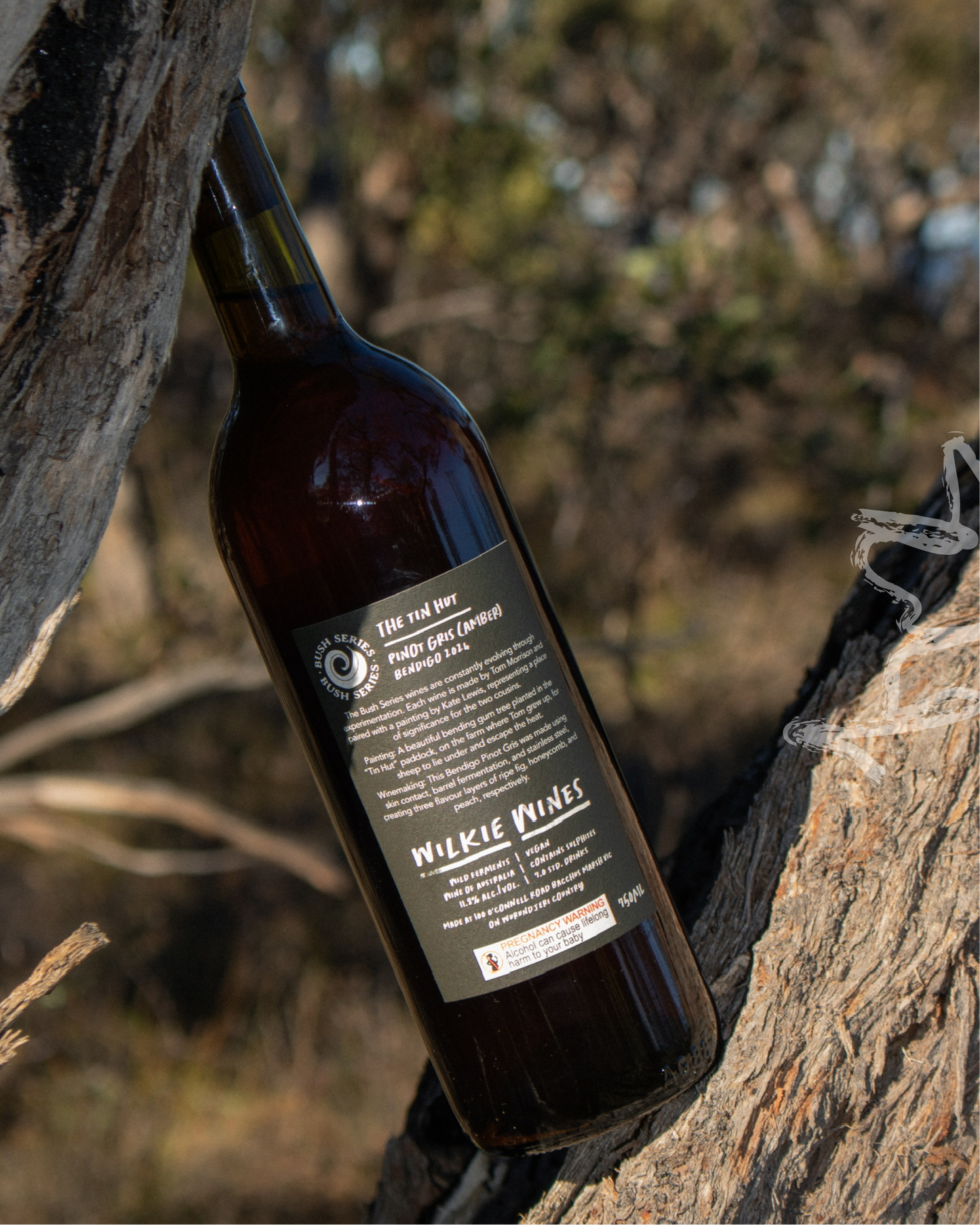 Wine bottle with label on a natural wooden background