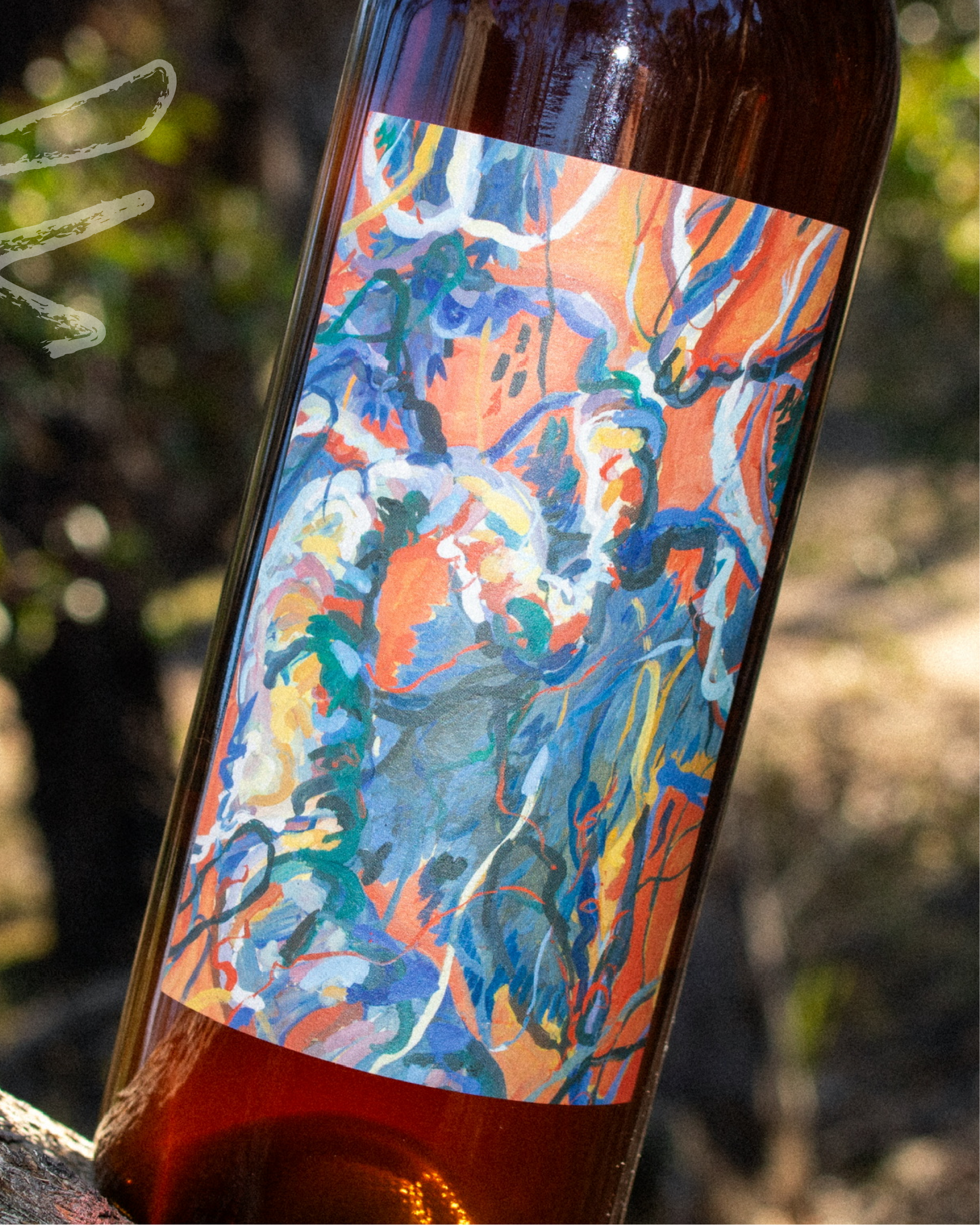 Wine bottle with a colorful label featuring abstract art.