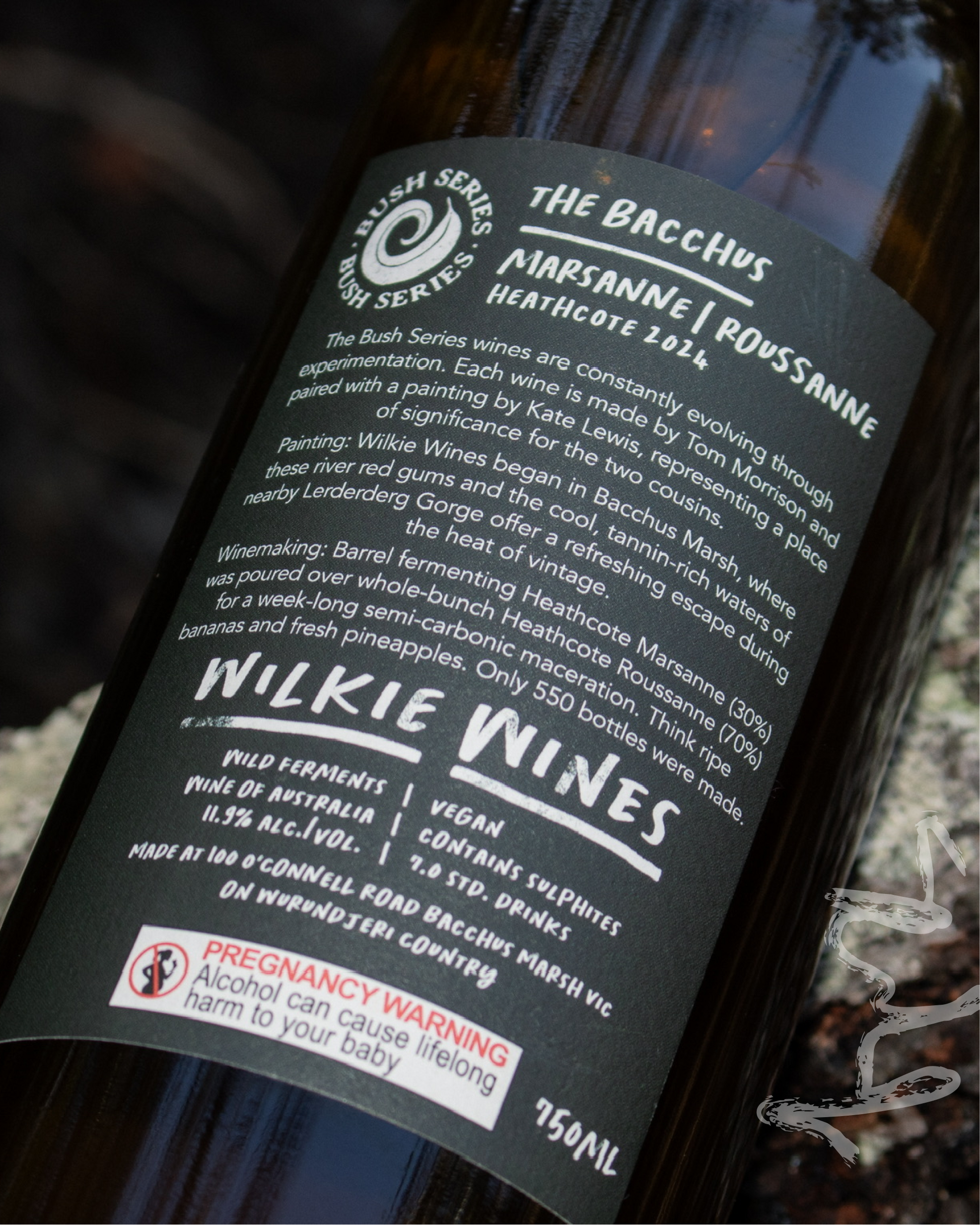 Close-up of a Wilkie Wines bottle label with detailed text.